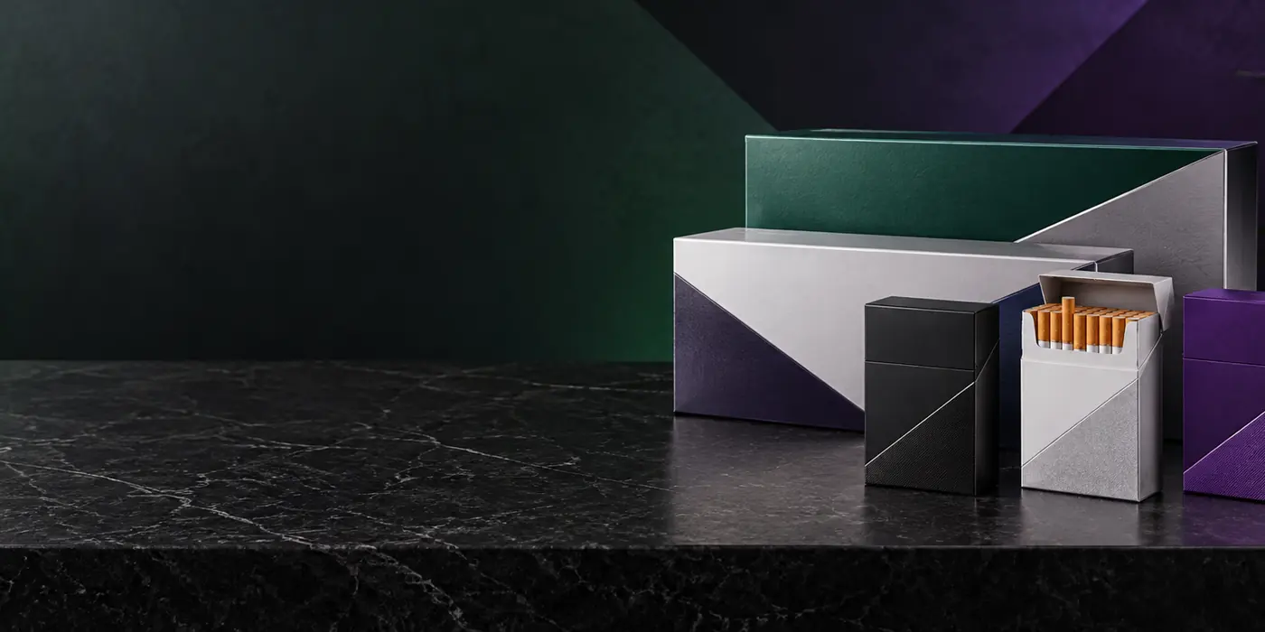 Unbranded cigarette packs and cartons on a dark retail counter